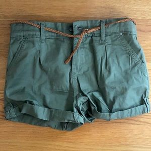 Green shorts with brown belt